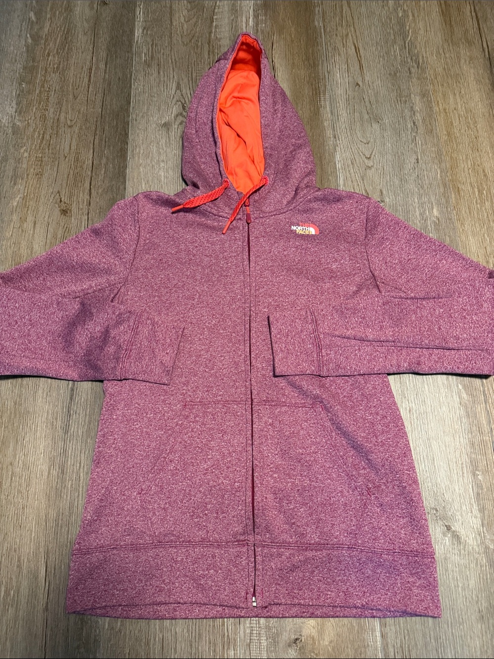 The North Face mauve heater zip up hoodie featuring a vibrant orange contrast